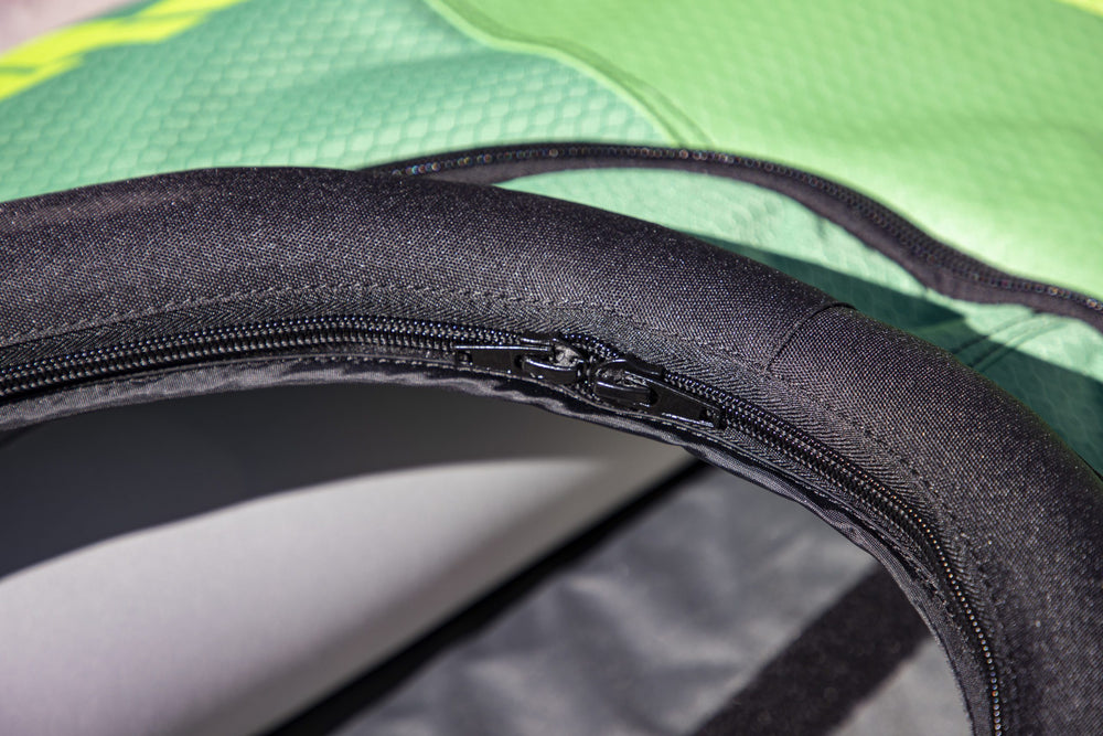 Close-up of a zipper on a Navarro 145 touring deck cover, green and black fabric.