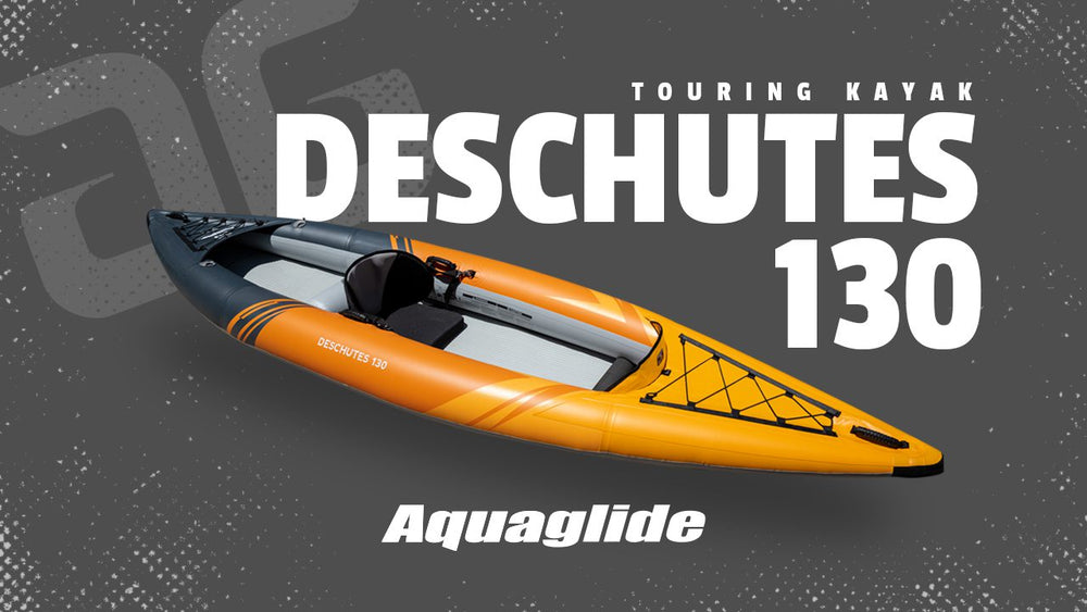Orange/gray Deschutes 130 Package open deck kayak on gray.