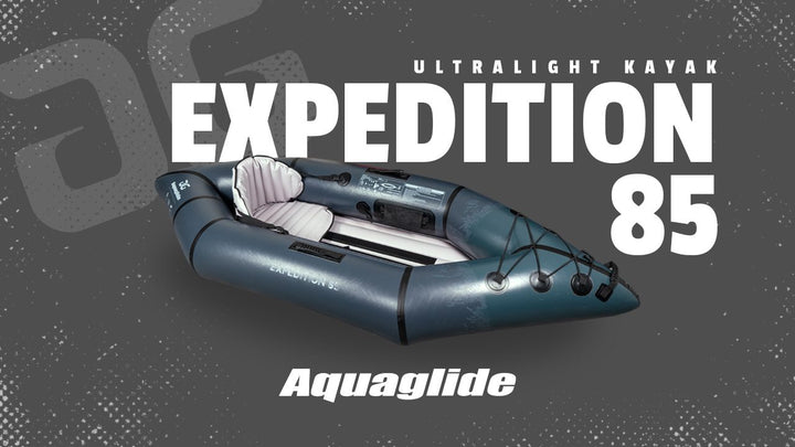 Gray inflatable Backwoods Expedition 85 solo touring kayak for ultralight adventures.