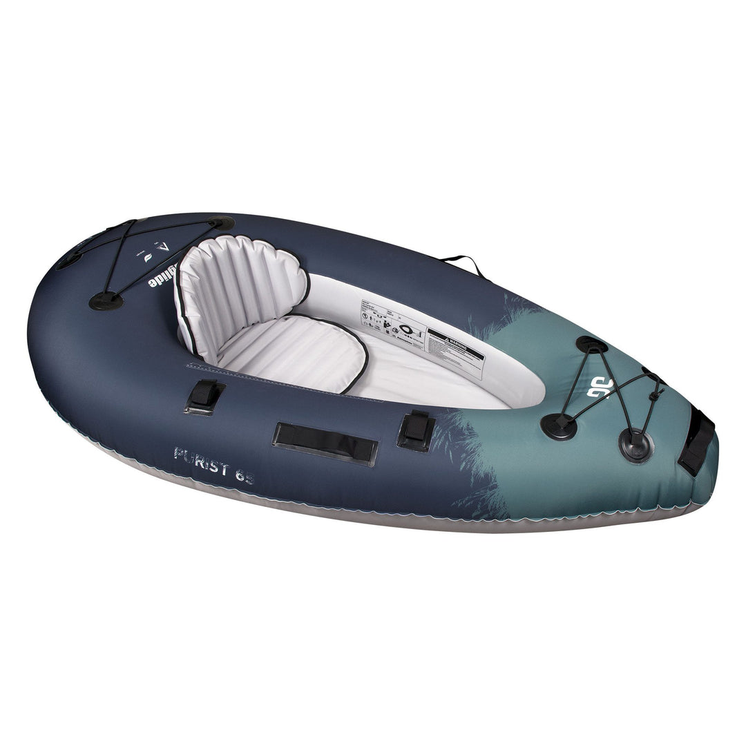 Backwoods Purist 65 kayak with dark blue exterior and padded white interior seat.